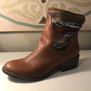 Brown booties with rainbow detailing.